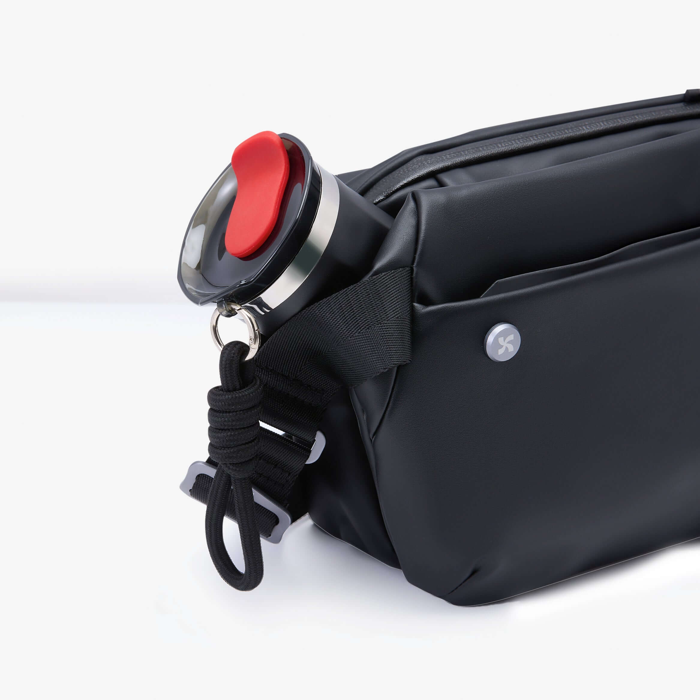 City Essentials Set featuring a sleek black bag with a portable tumbler, perfect for urban adventures and coffee breaks.