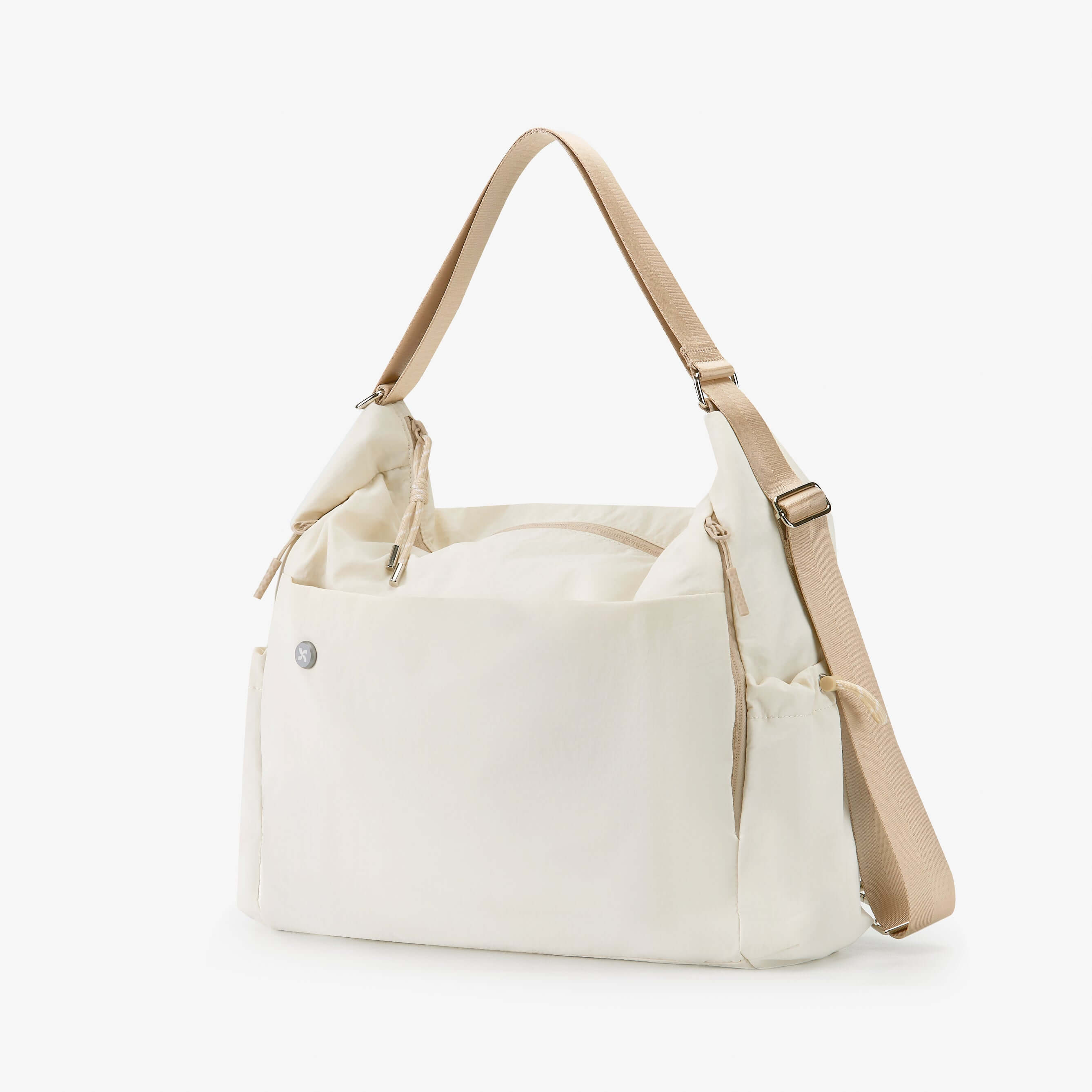 Air Convert Tote in cream color, made from organic fabric, features stylish straps for versatile carry options.