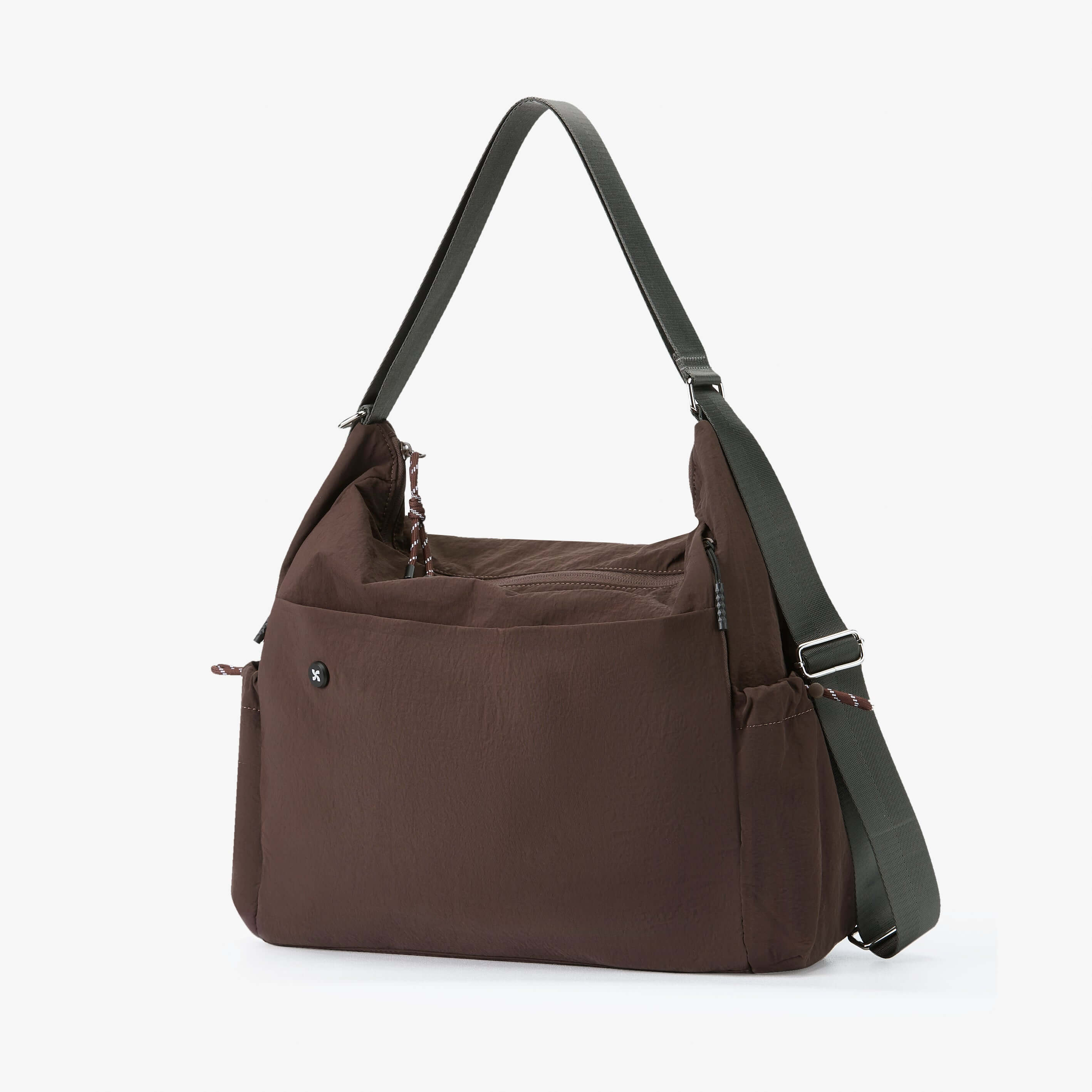 Air Convert Tote in dark brown made from organic fabric; versatile design for urban life, features adjustable straps.