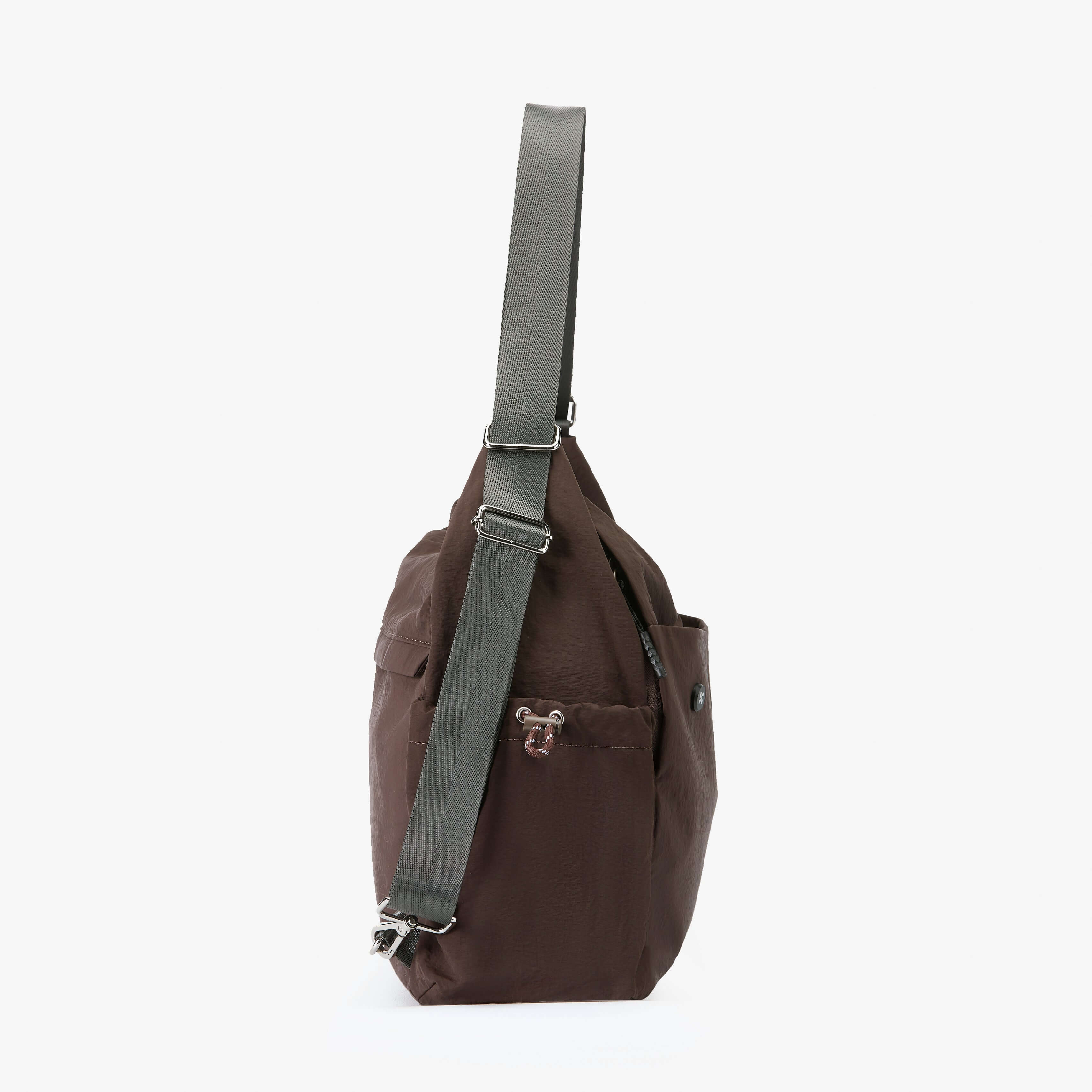 Air Convert Tote in dark brown, featuring organic fabric and versatile design for urban lifestyles.