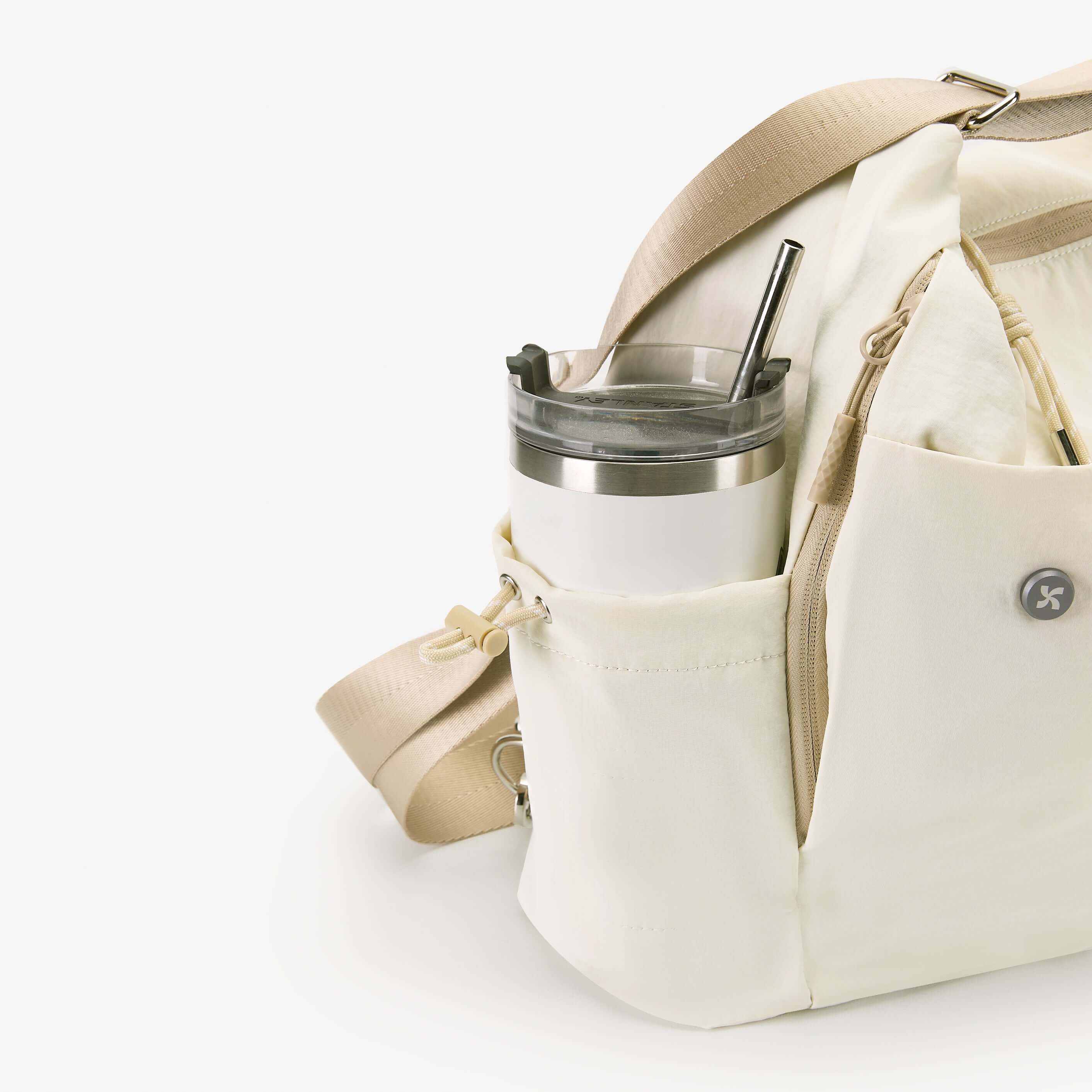 Air Convert Tote in organic fabric showcasing a drink holder, designed for urban lifestyles with air comfort.