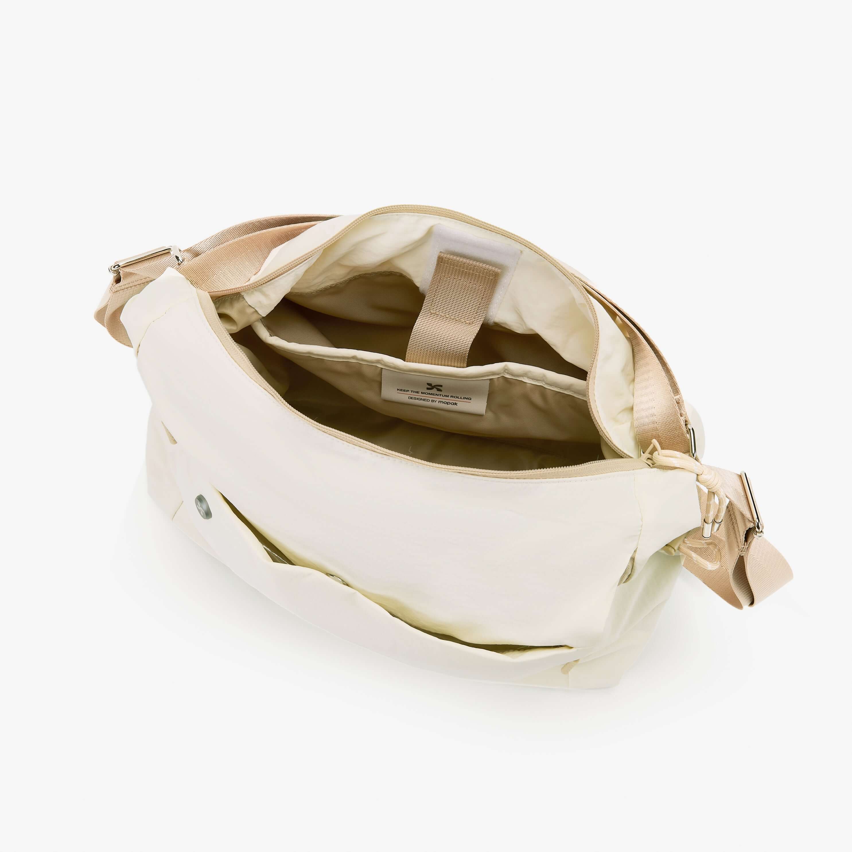 Interior view of the Air Convert Tote featuring organic fabric, showcasing spacious compartments for urban convenience.