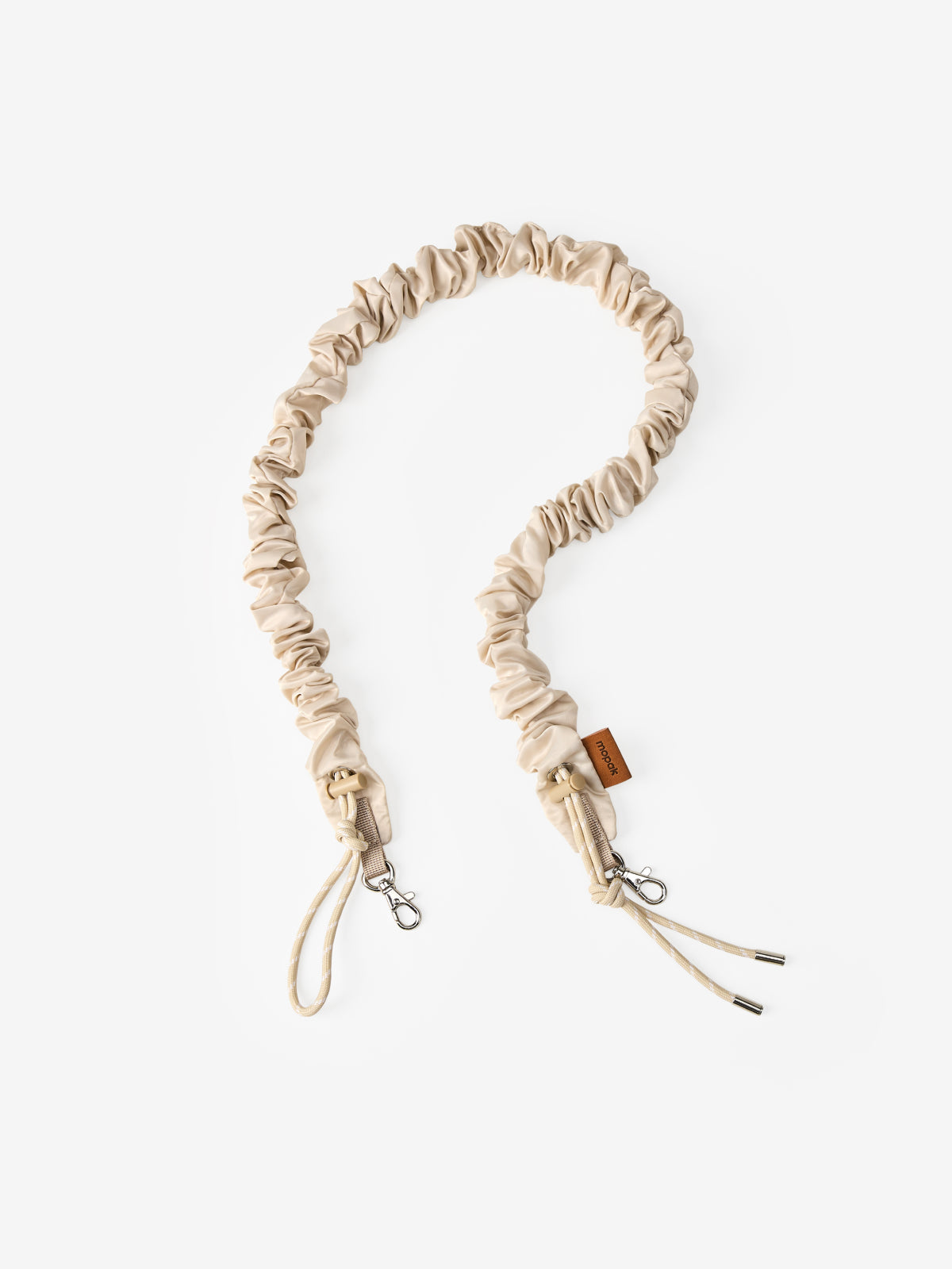 Lumen Luna Strap, a detachable crossbody phone strap with scrunchie texture for easy carrying.