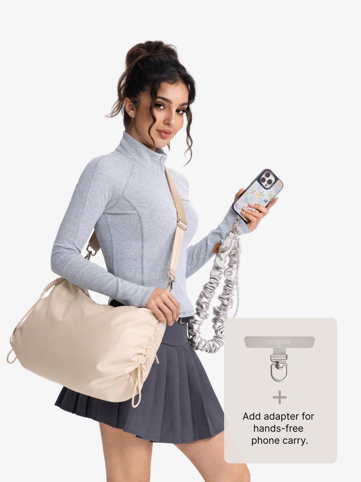 Model showcasing the Lumen Luna set bag with hands-free phone carry adapter in a stylish outfit.