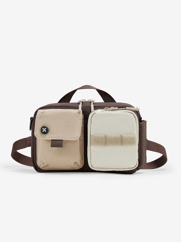 Multicolored bag with beige, brown, and white sections on a white background