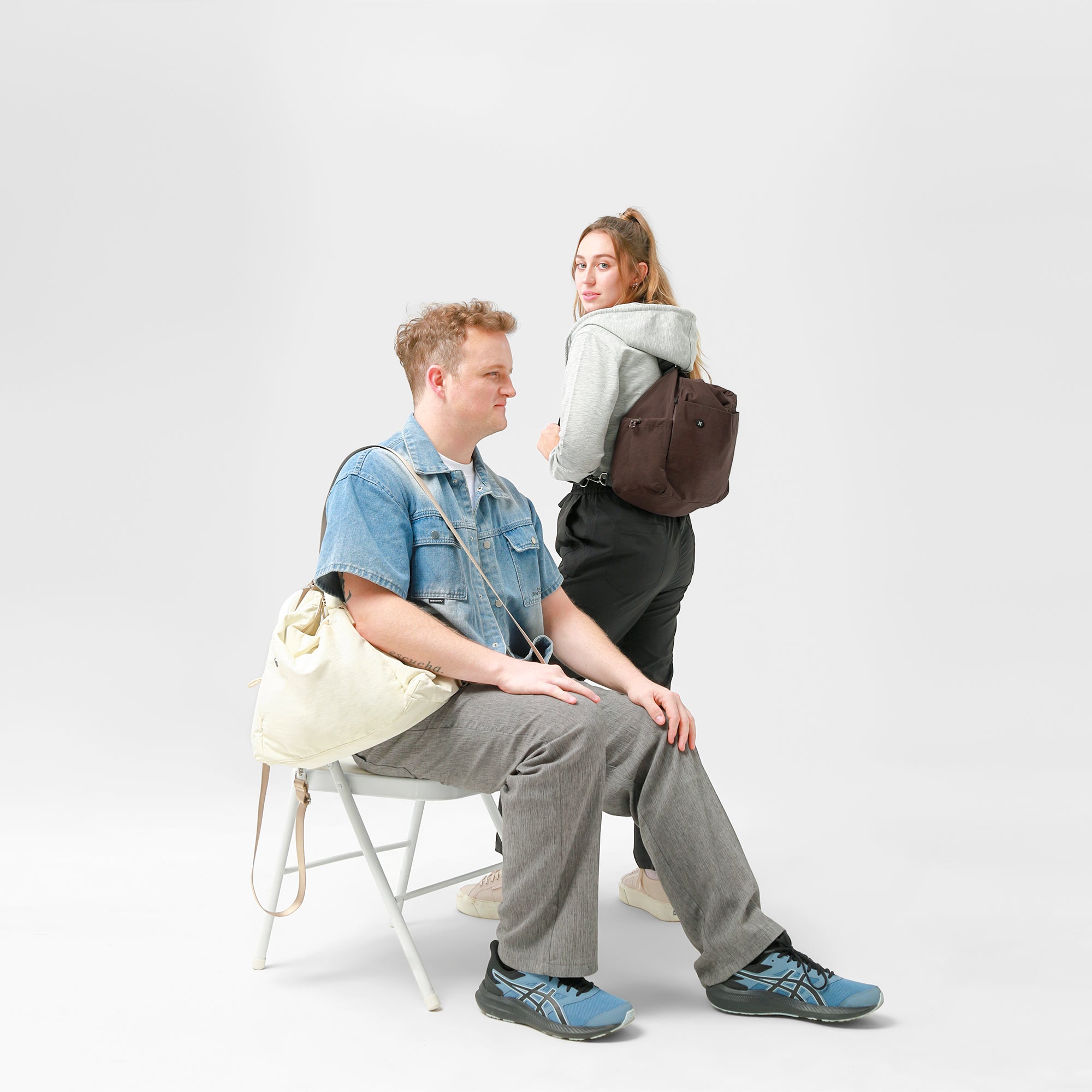 Two people with mopak bags in London studio